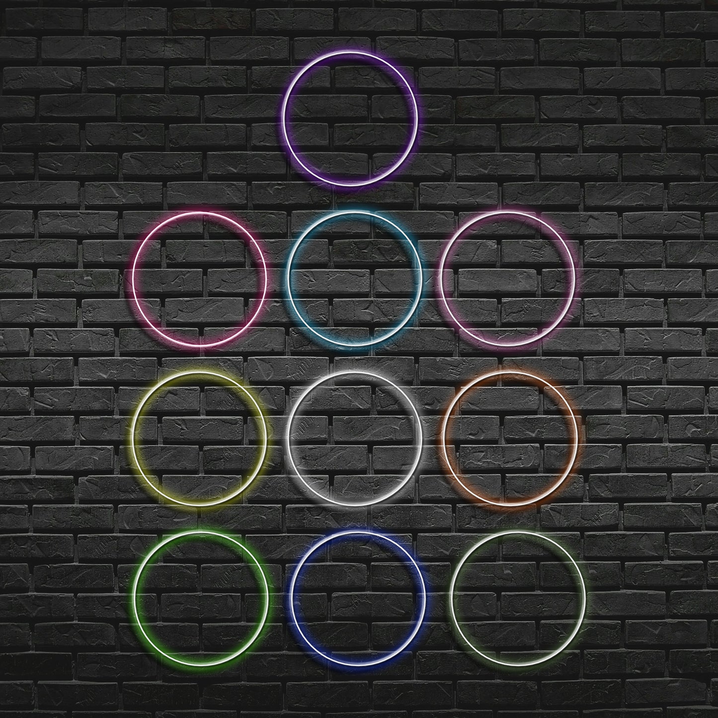Neon rings in various colors arranged in a pyramid shape on a black brick wall.