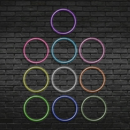 Neon rings in various colors arranged in a pyramid shape on a black brick wall.